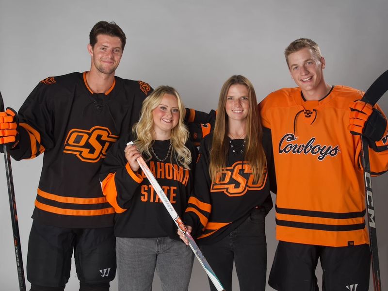 Staff members in Oklahoma State Hockey jerseys